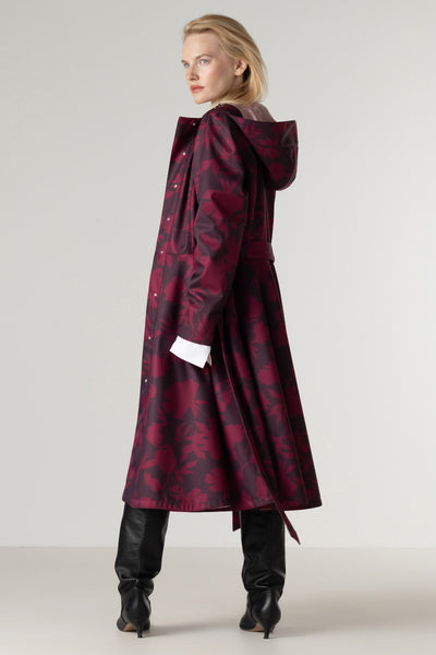Back view of a women's burgundy floral fit and flare coat with a full circle skirt and elegant deep wine floral print.