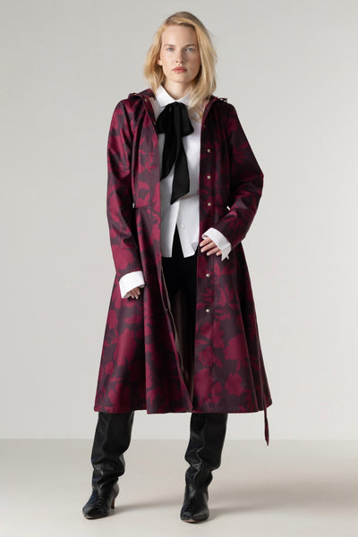 Women's burgundy floral coat opened to reveal luxurious ashy pink Italian satin lining and a full circle skirt.