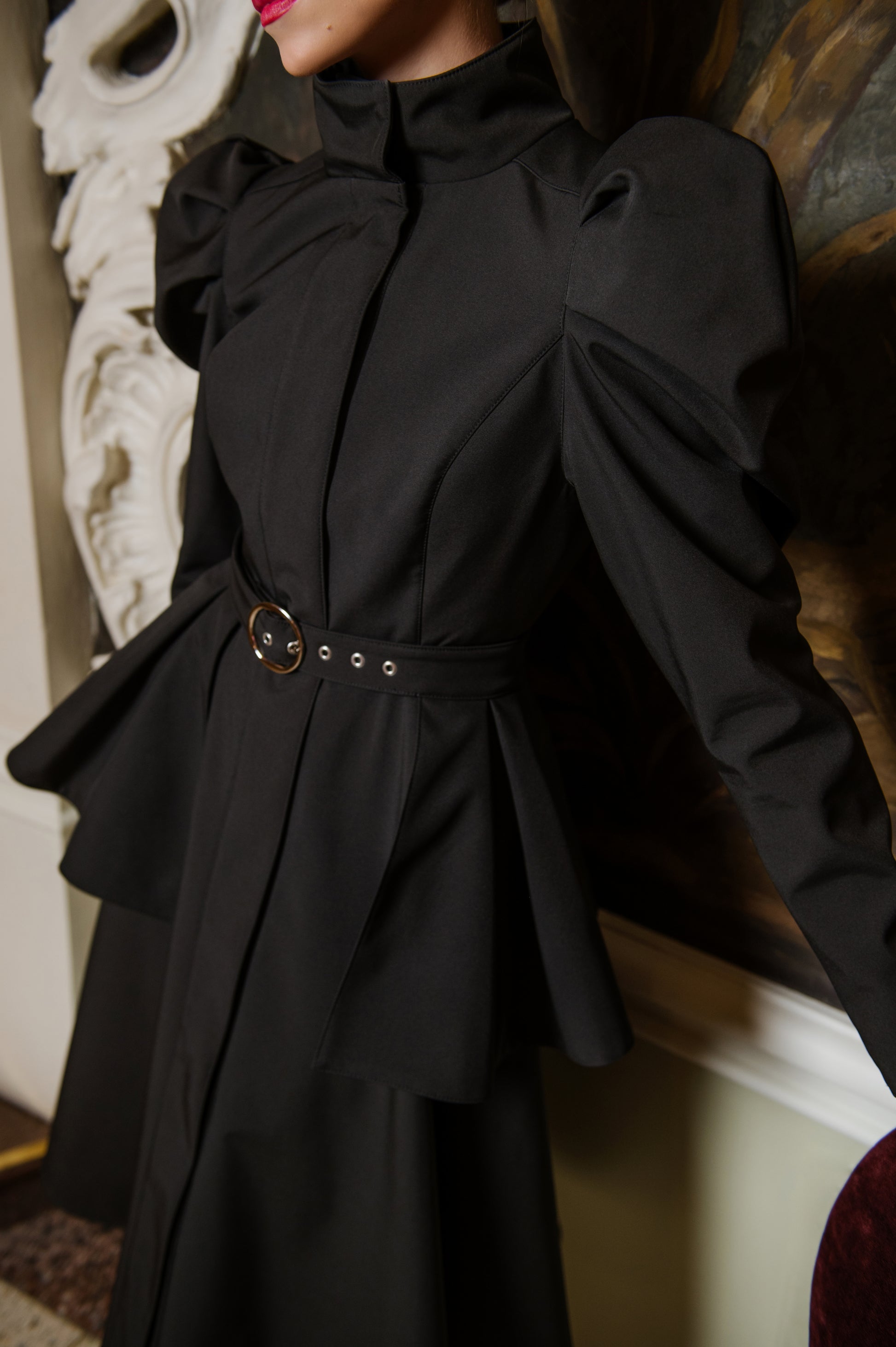 black coat with black ruffled belt