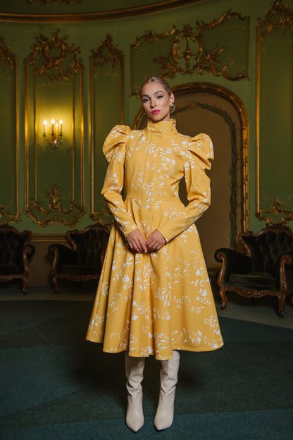 yellow coat with white floral print and ballooned styled sleeves
