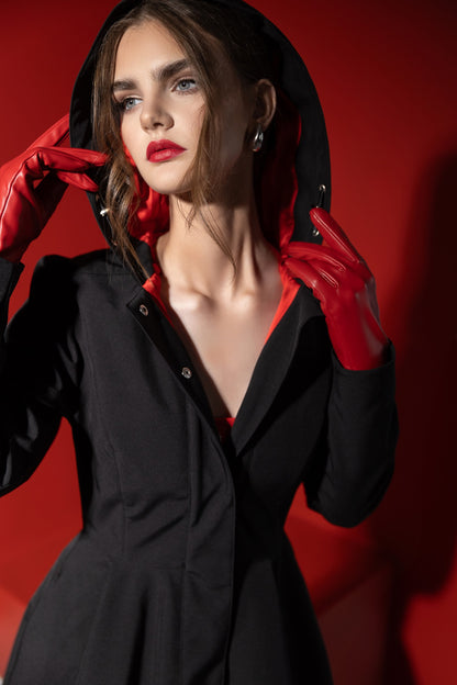 Hooded black coat with bright red lining