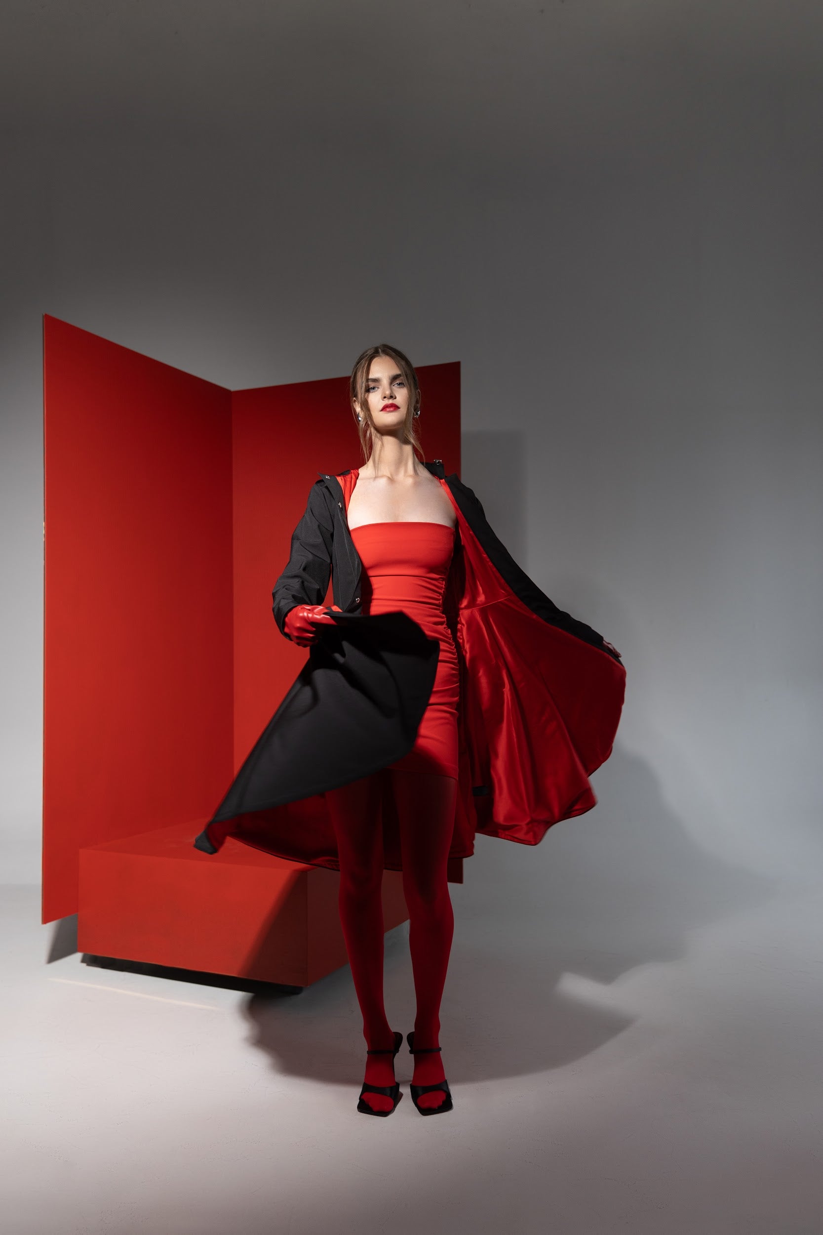 flared black coat with full body lining in red
