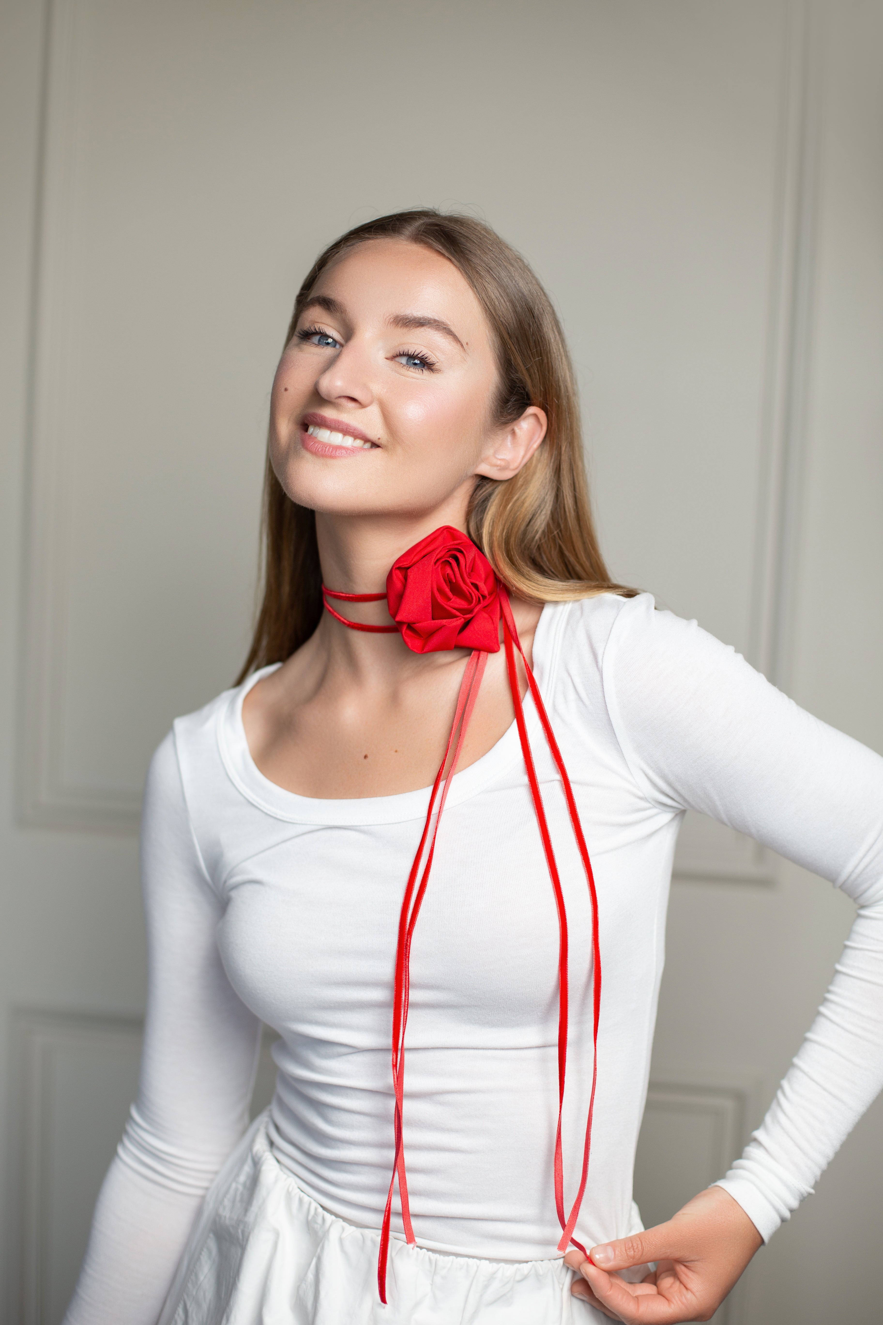 Romantic floral choker featuring a bold red rose centerpiece