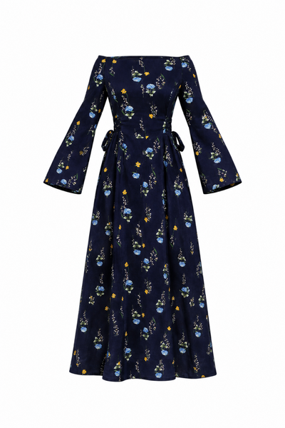 A navy blue off-the-shoulder maxi dress with long bell sleeves, featuring a delicate blue and yellow floral pattern and a tie waist, shown against a plain white background.
