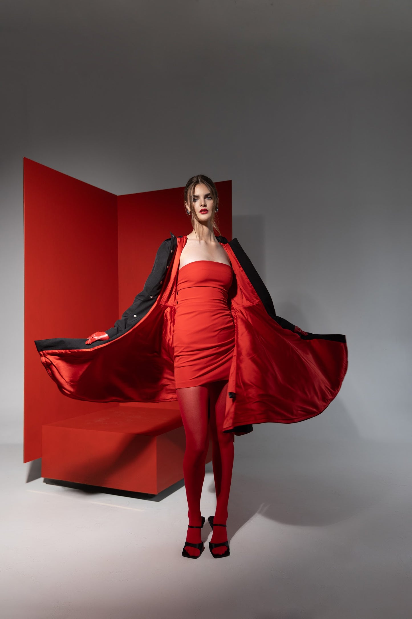 fitted and flared water resistant coat with bright red full body lining