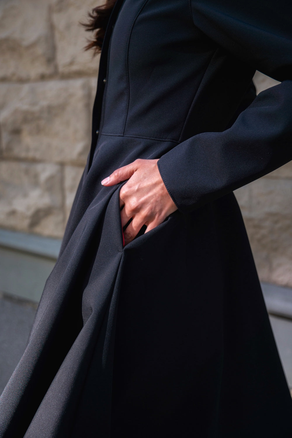 black coat with hidden closure, pockets and full body lining