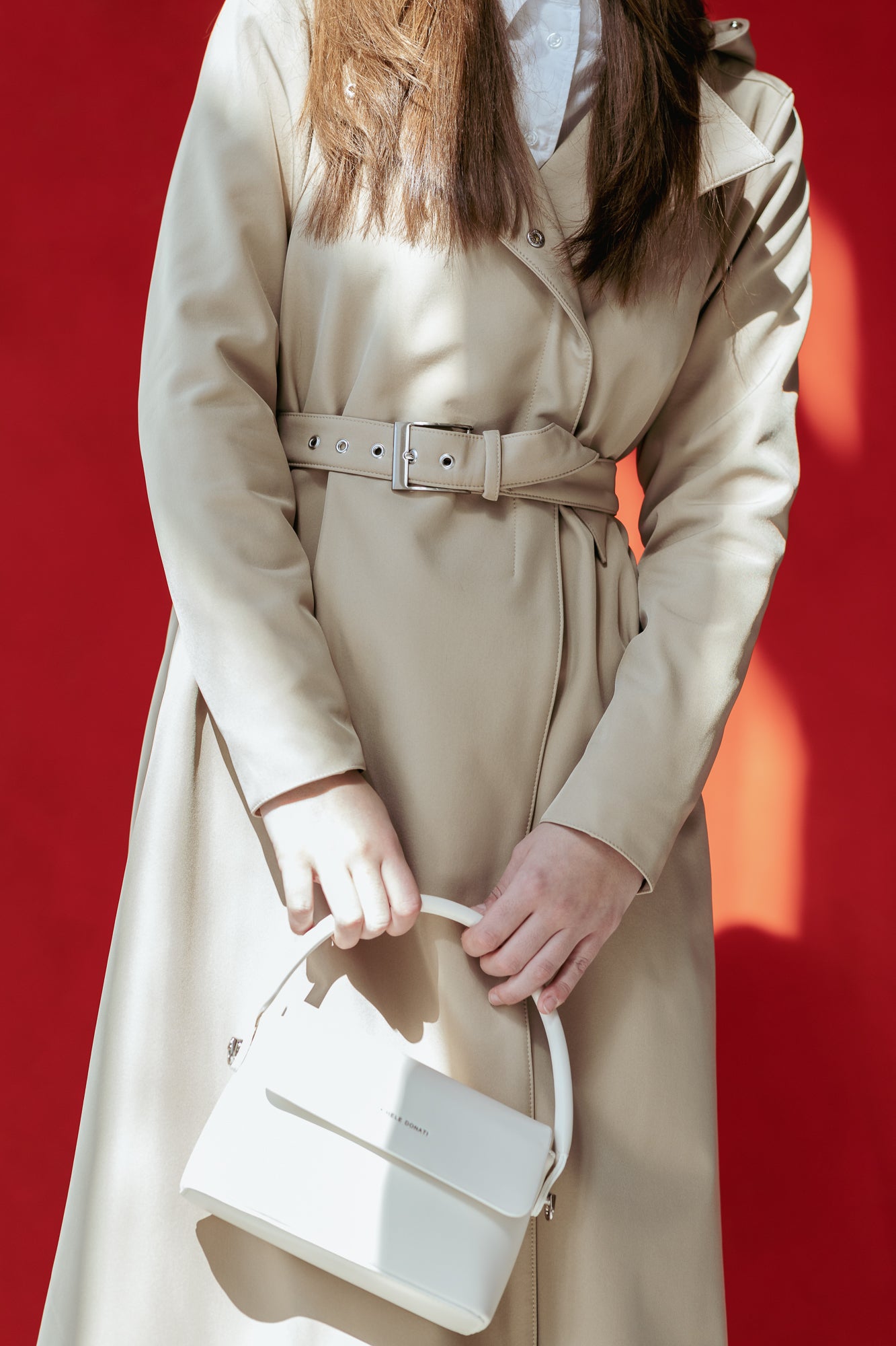 Beige Coat with belt featuring silver tone hardware