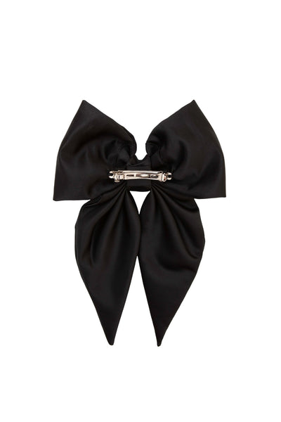 Black bow hair clip on a white background