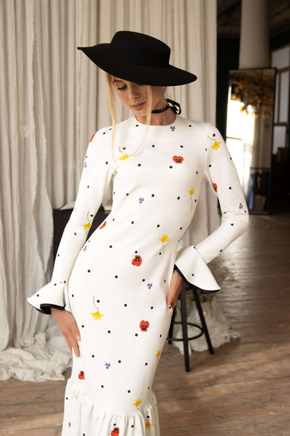 Dancing Romance white viscose maxi dress with black polka dots and floral print, slim fit bodice, flowing ruffled hem, perfect for special occasions.