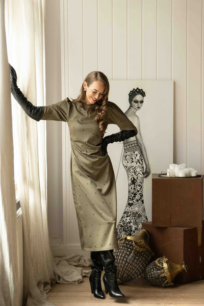 Chic tencel satin midi dress featuring delicate back cutout with ribbon tie and high neckline for vintage elegance.