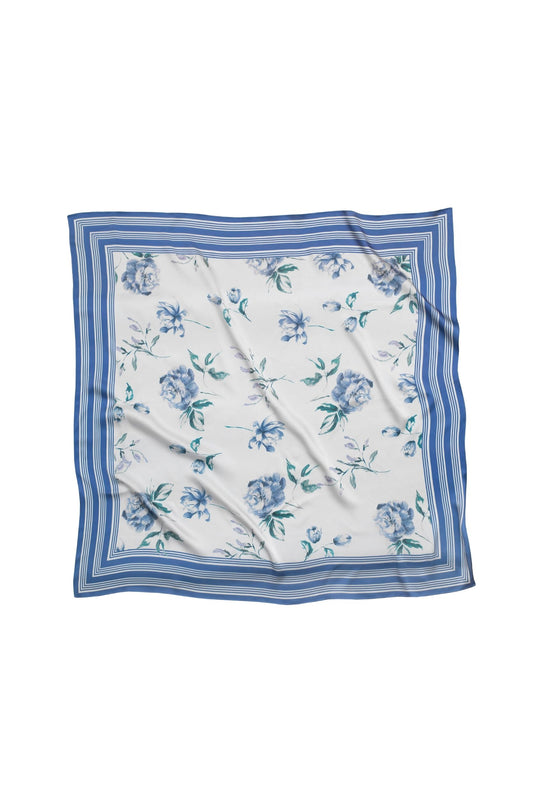 Floral patterned scarf with blue border on a white background.