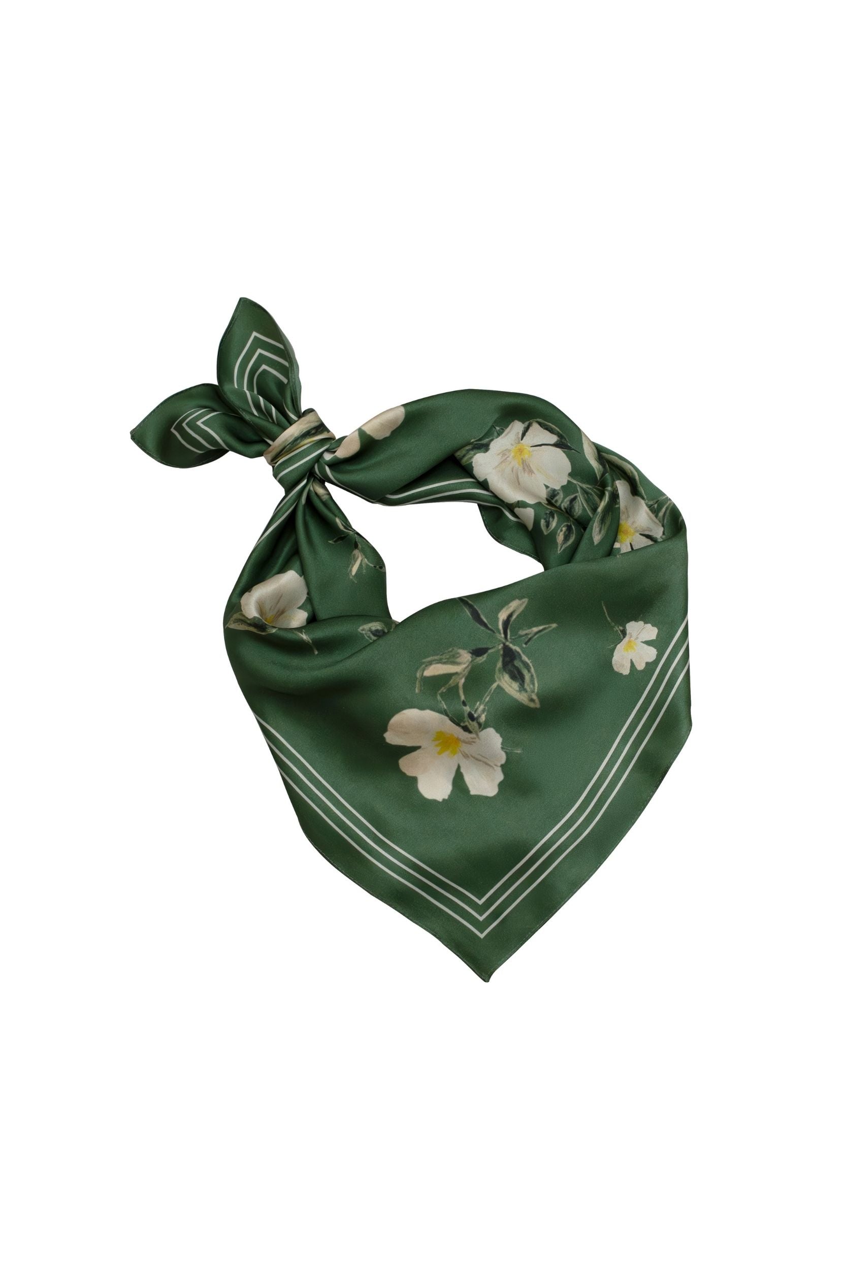 Green scarf with floral patterns on a white background