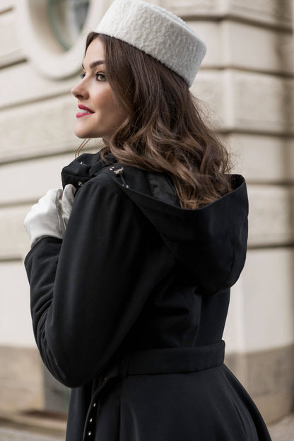 Luxurious and sustainable black winter coat, lined with recycled Italian satin for comfort.