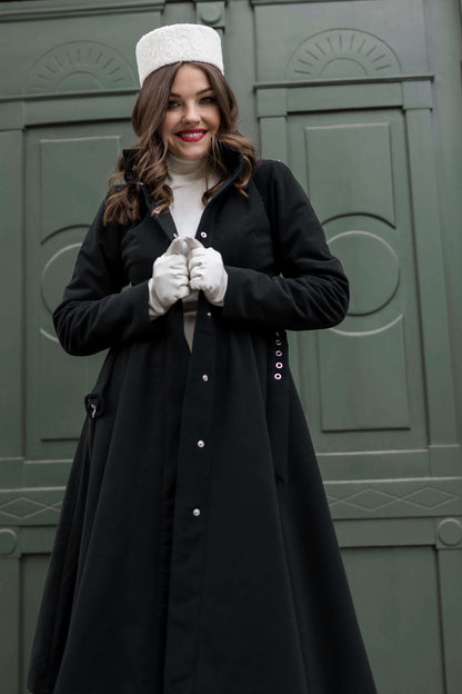 Model in the Obsidian Frost coat with luxurious black Italian satin lining, a sustainable winter essential.
