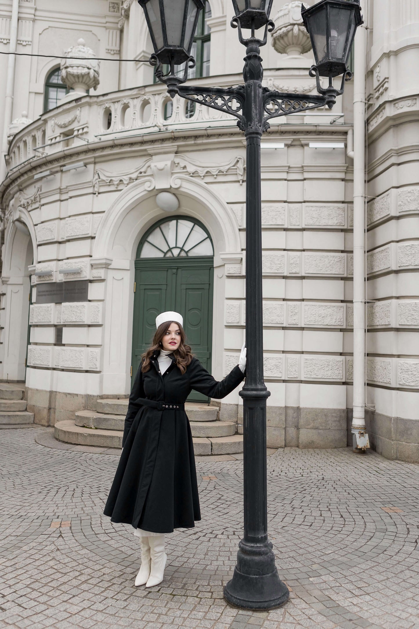 Luxury winter outerwear for women — Obsidian Frost coat with hidden side pockets and fitted bodice.