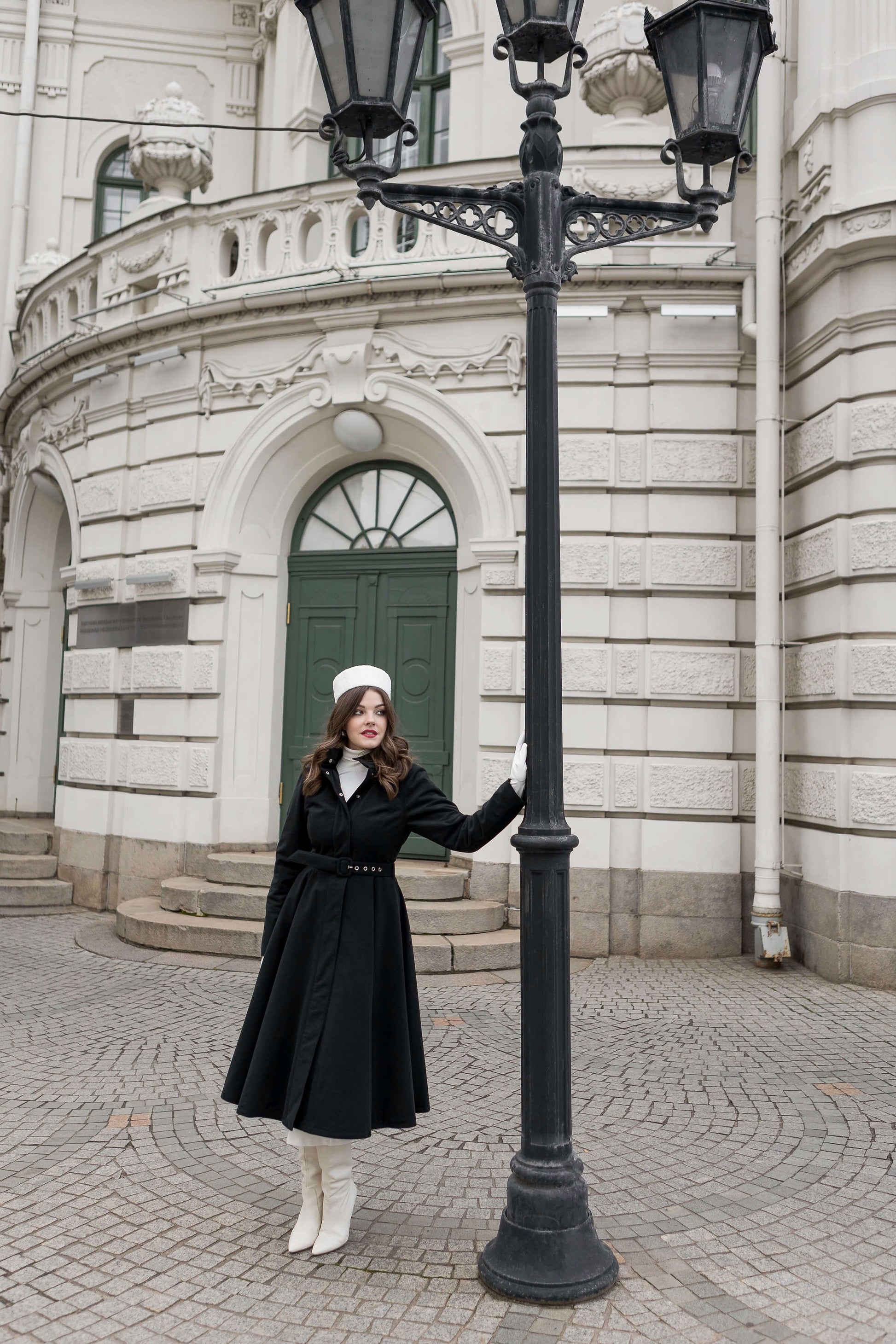 Luxury winter outerwear for women — Obsidian Frost coat with hidden side pockets and fitted bodice.