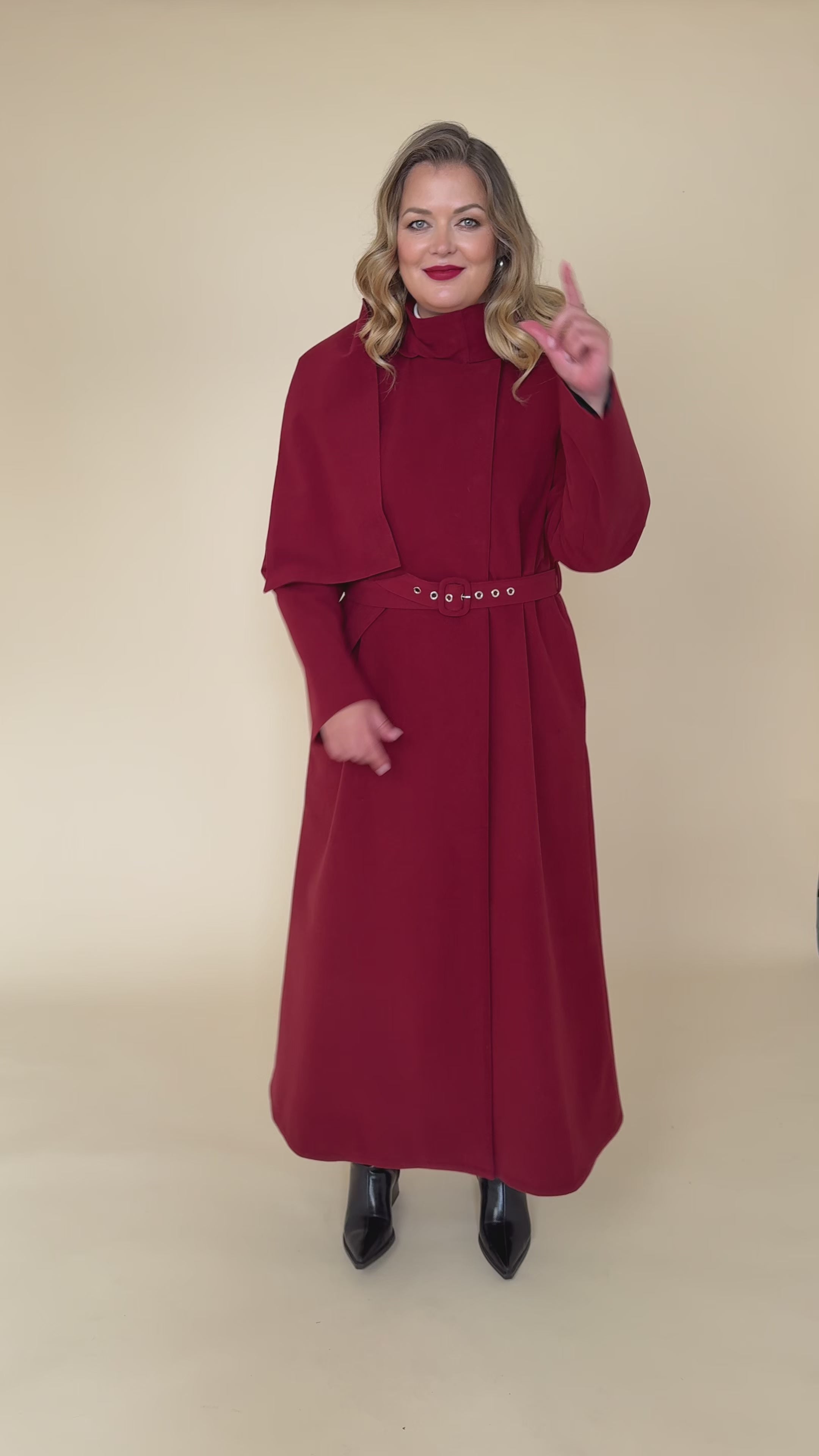 Load video: Women’s long winter maroon coat video – warm, waterproof, and elegant outerwear for cold weather.