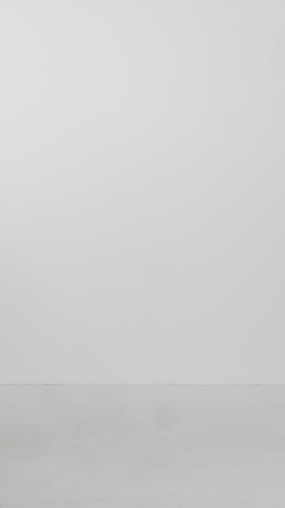 Women's berry double-breasted trench coat showcased in a studio, highlighting its elegant silhouette and flowing movement.