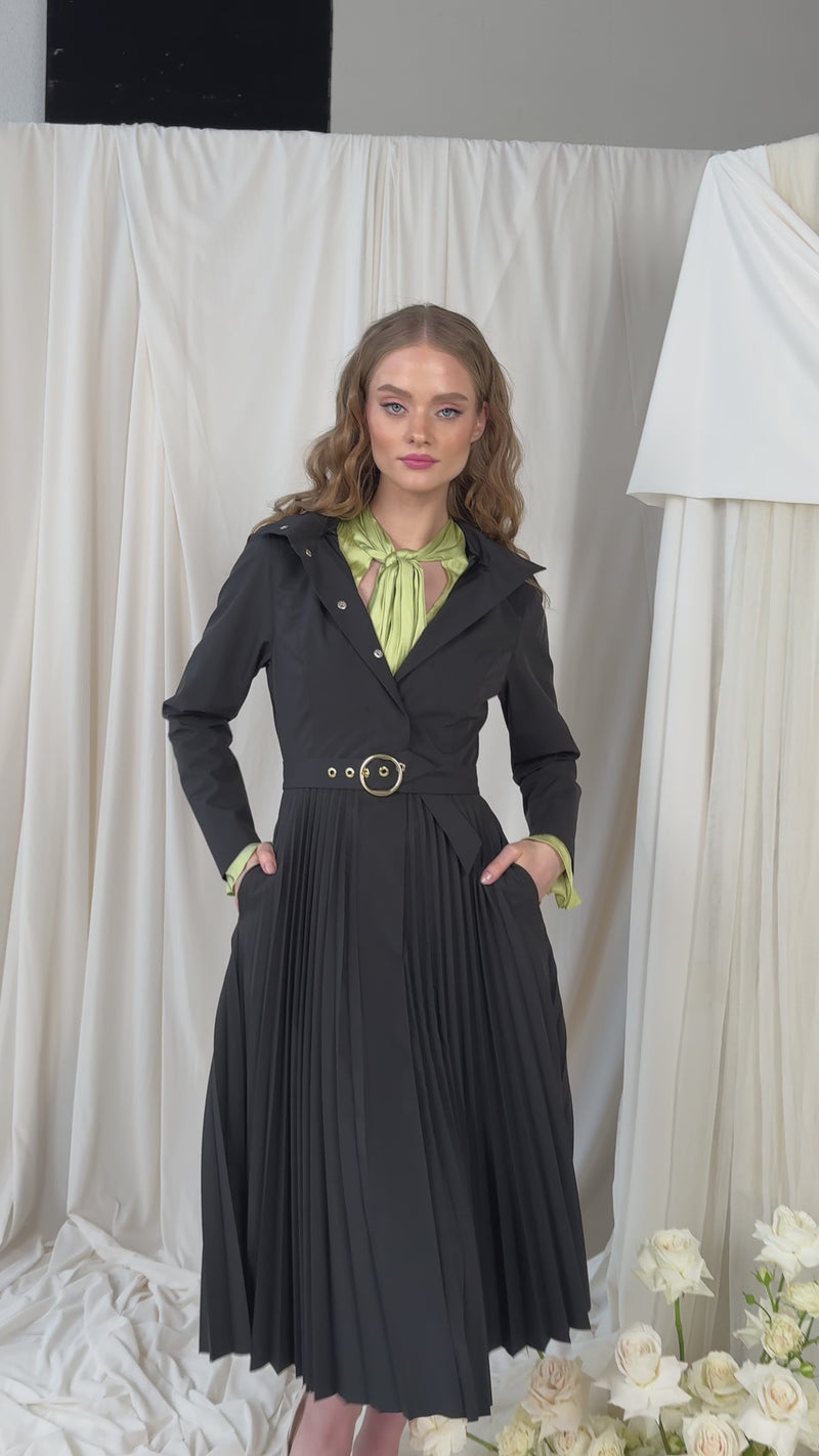Video of black coat with fully pleated skirt