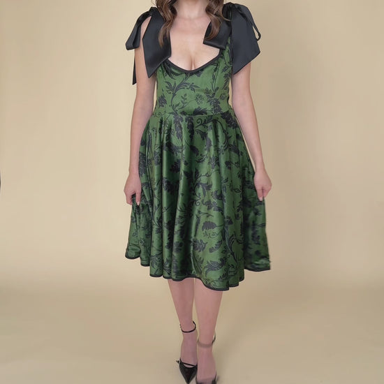 Green velvet dress with black graphic print – Forest Kiss video showing its elegant movement and rich texture.