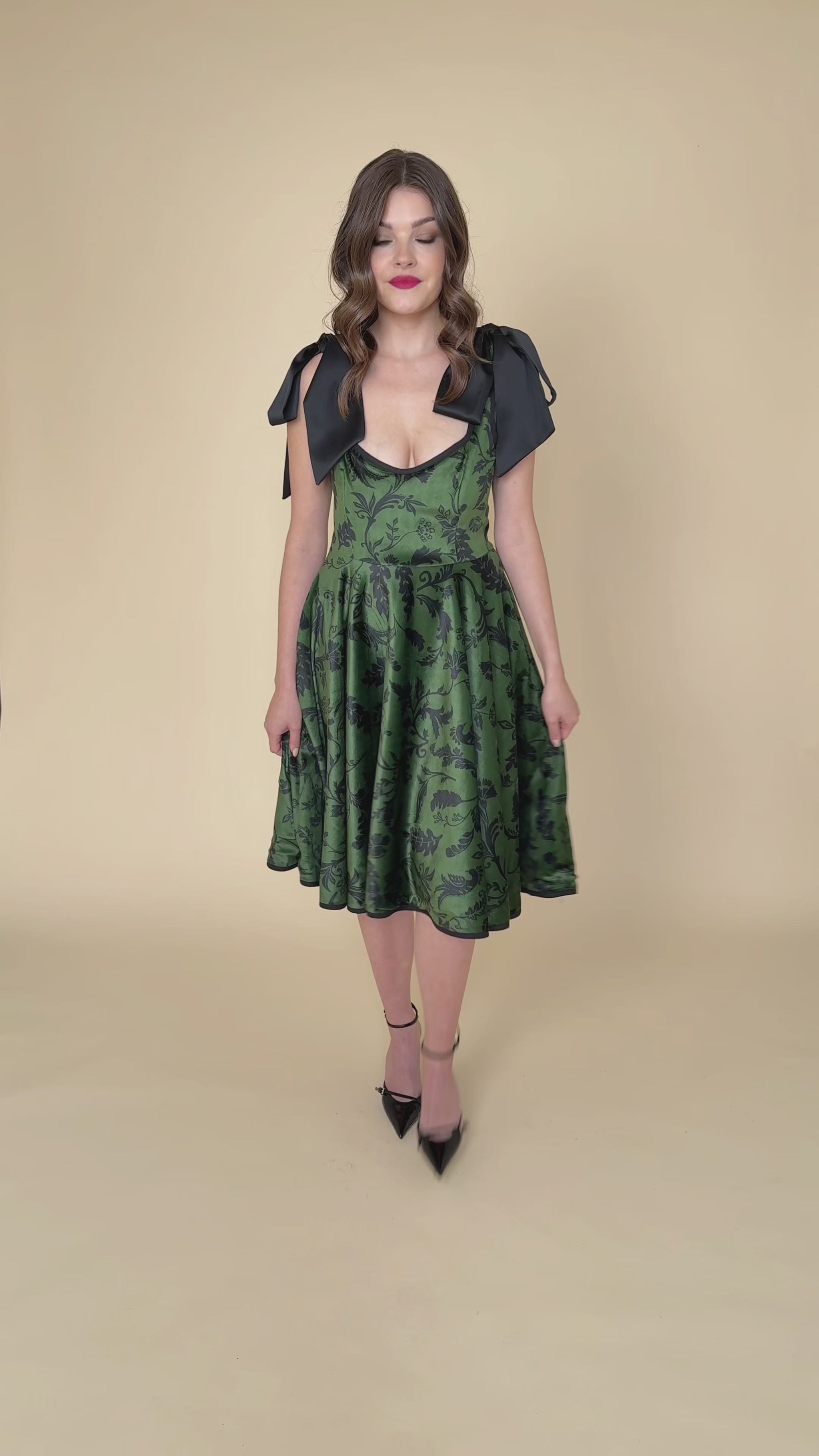 Green velvet dress with black graphic print – Forest Kiss video showing its elegant movement and rich texture.