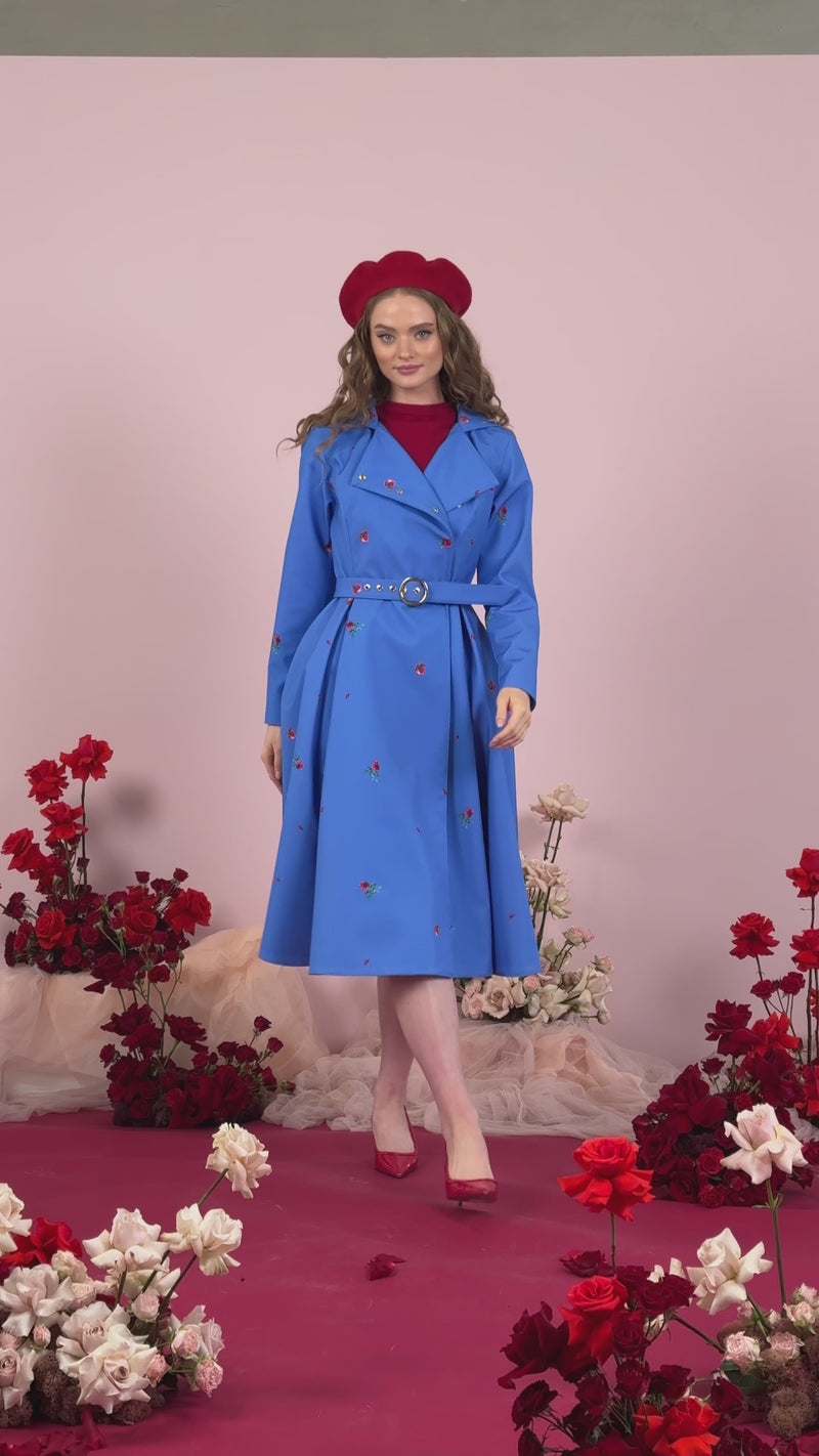 Video of blue coat with red flowers print