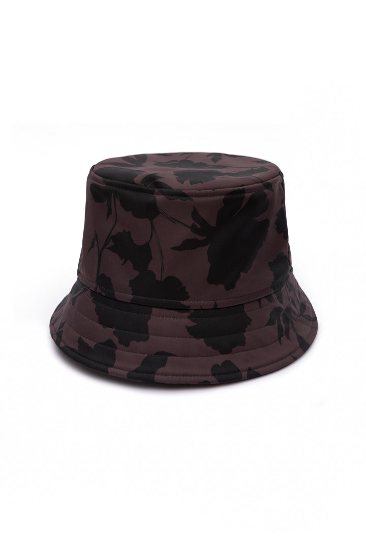 Brown floral softshell bucket hat for women featuring a black floral print, water-resistant fabric, and breathable cotton lining.