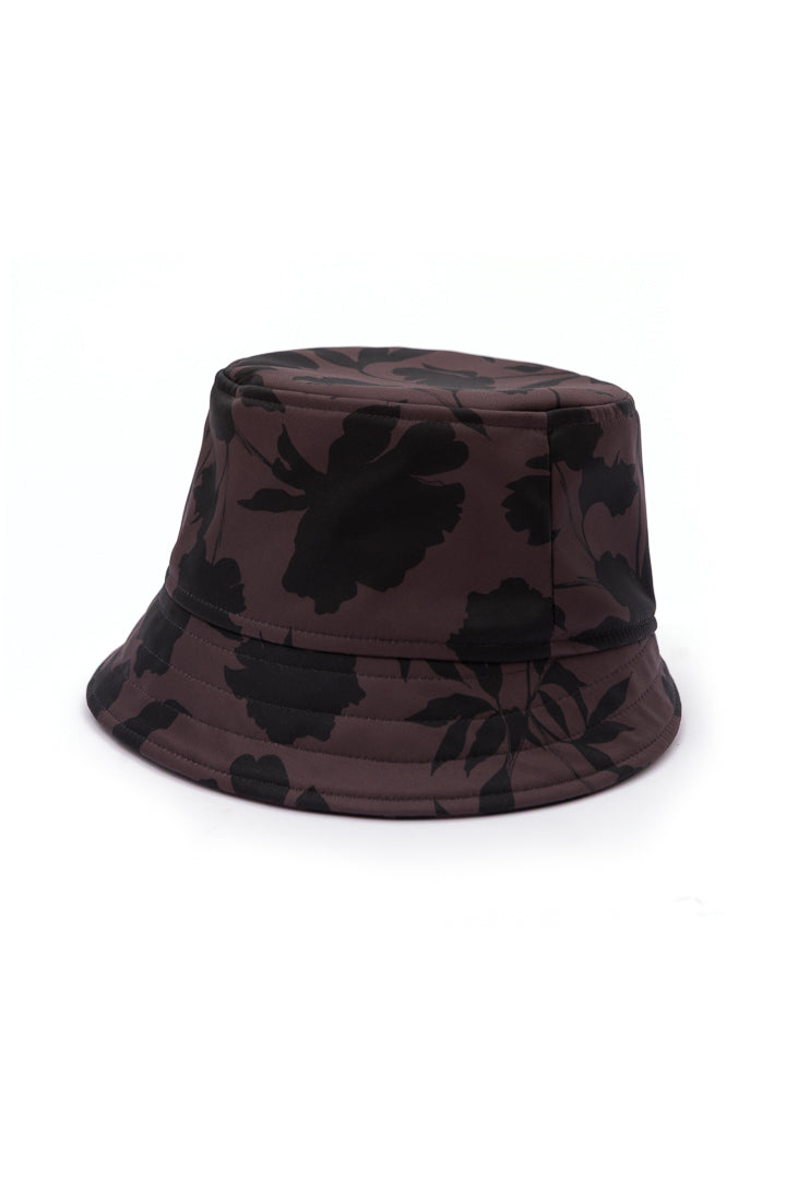 Women's brown floral bucket hat in water-resistant softshell fabric with an elegant black floral print and soft cotton lining.