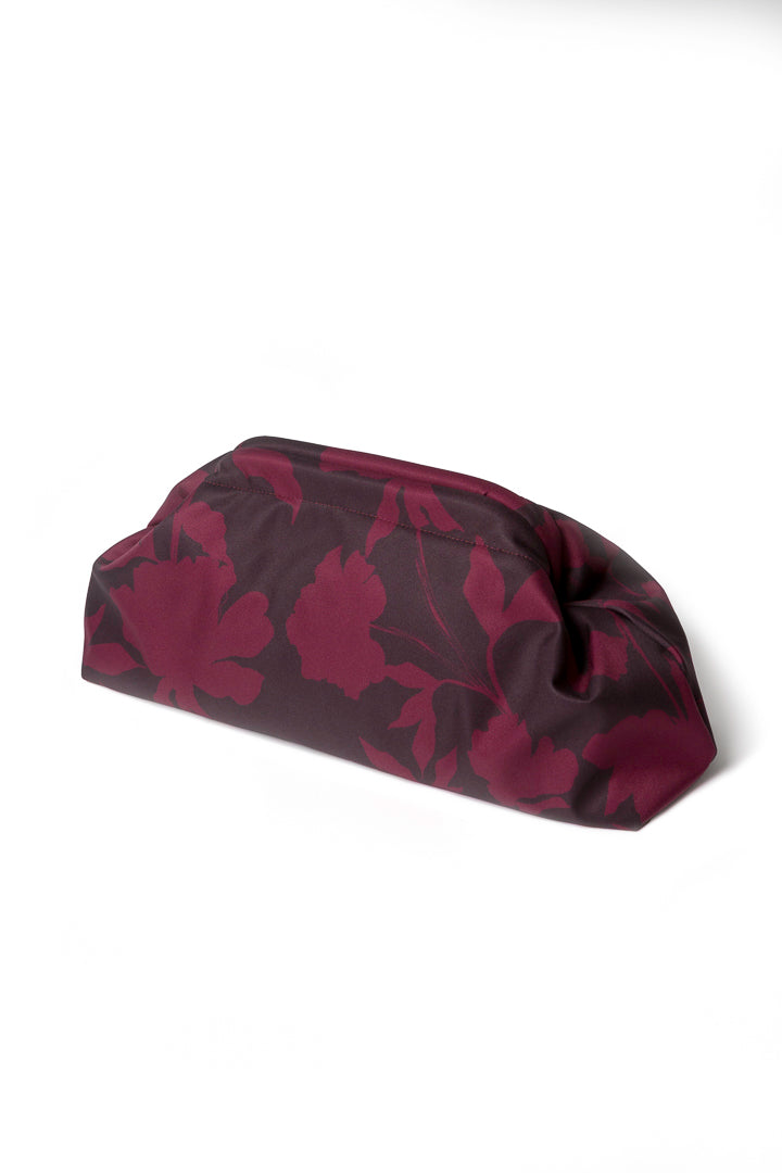 Burgundy floral clutch bag showcasing the rich wine-toned floral print, vintage-inspired frame closure, and beautifully structured design.