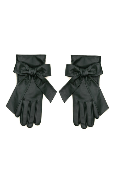 A pair of deep green leather gloves with wide cuffs and large bow details, displayed flat against a white background.