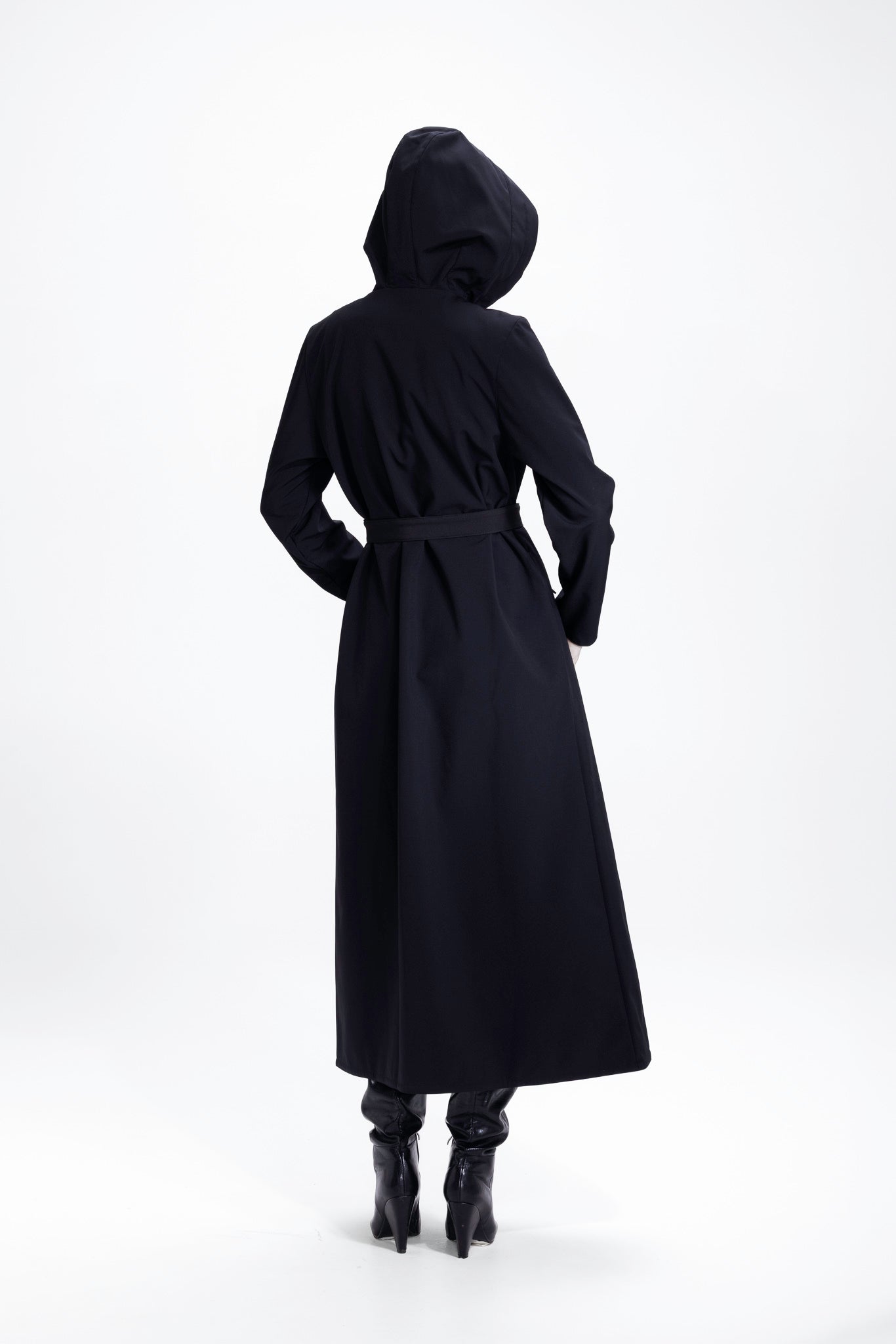 Back view of black women's double-breasted coat with flared trapeze shape