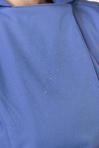 Close-up of powder blue tailored fabric on women's designer trench coat
