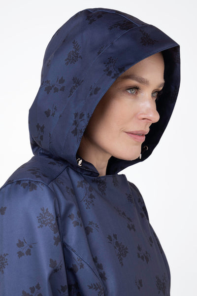 Close-up of hood detail on Blue Frost navy blue floral women's waterproof coat
