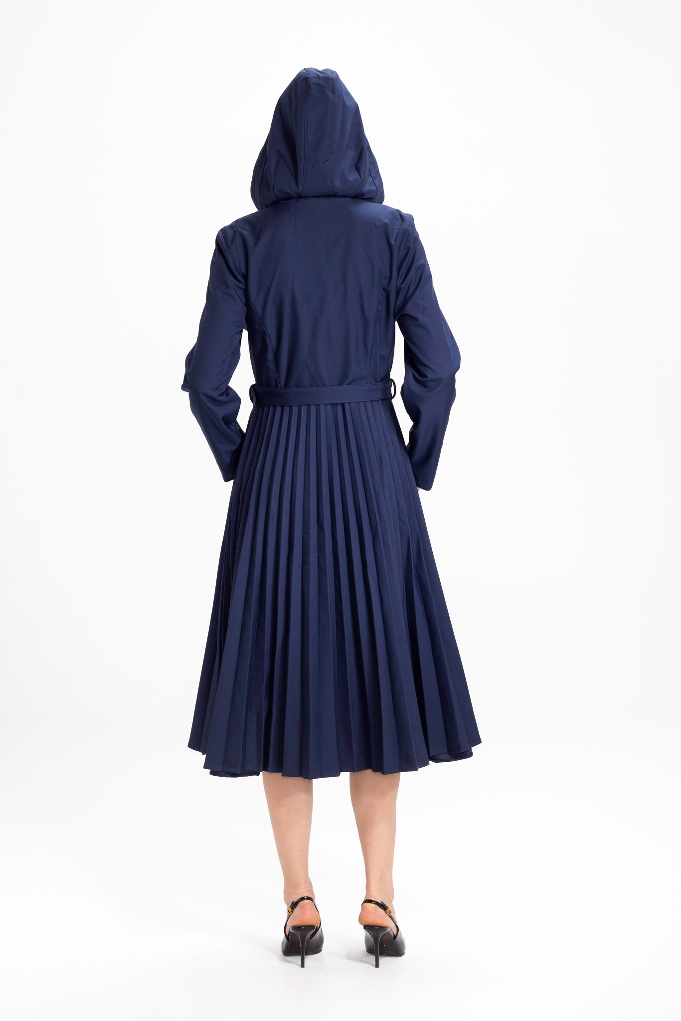 Back view of deep blue women's waterproof coat with tailored bodice and A-line silhouette