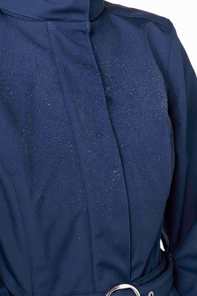 Close-up of structured bodice on deep blue women's designer coat