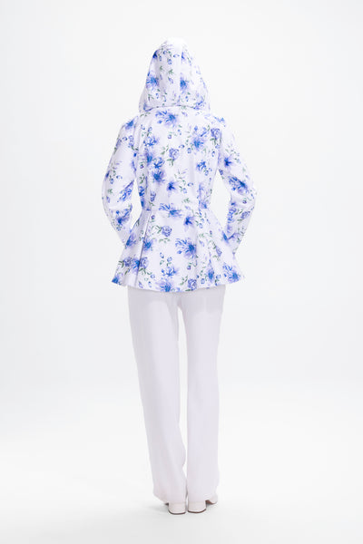 Back view of white floral women's jacket with blue flowers and green leaf pattern