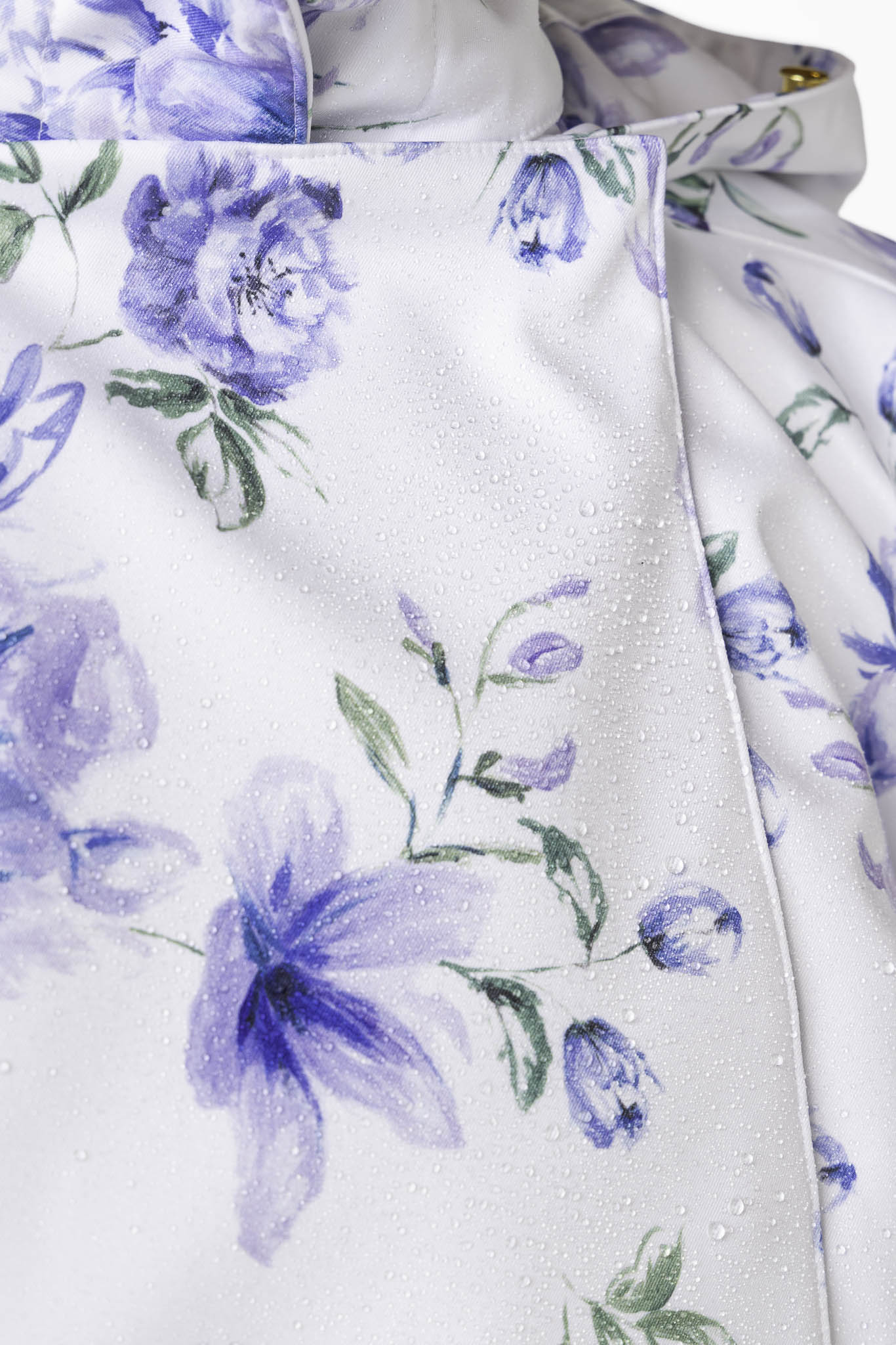 Blue flower and green leaf print detail on white women's designer jacket
