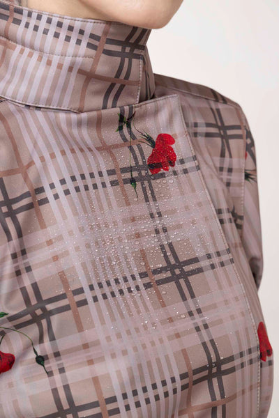 Beige plaid fabric with red floral accents on women's double-breasted trench coat by RainSisters