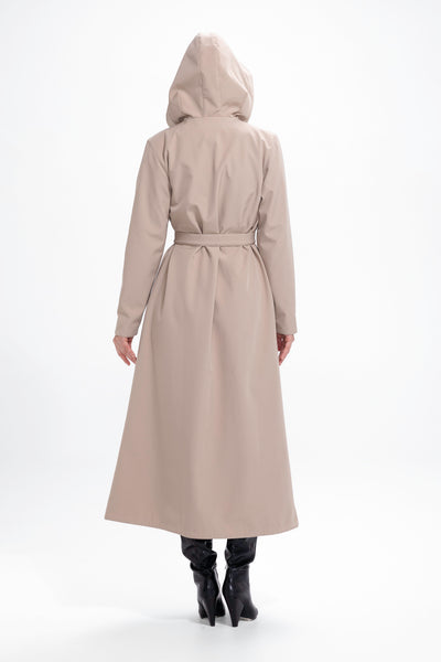 Back view of beige women's waterproof coat with flared trapeze cut and tailored fit