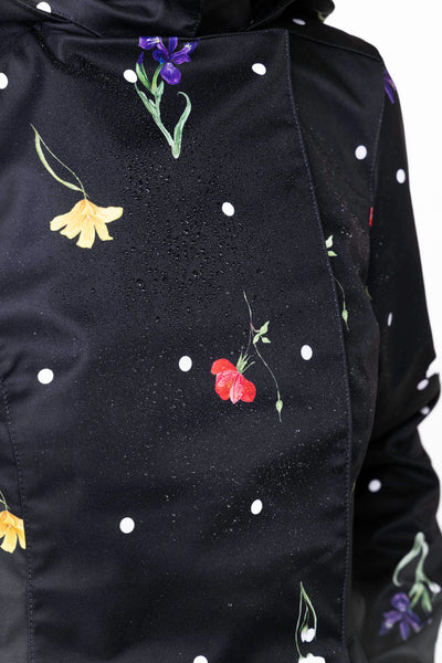 Vibrant floral print and white polka dot detail on black women's designer jacket