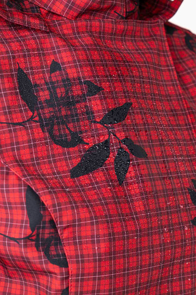 Plaid and small floral print detail on crimson red waterproof softshell women's jacket fabric