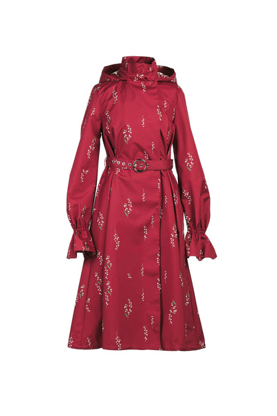 Red floral-patterned warerproof coat with a belt on a white background