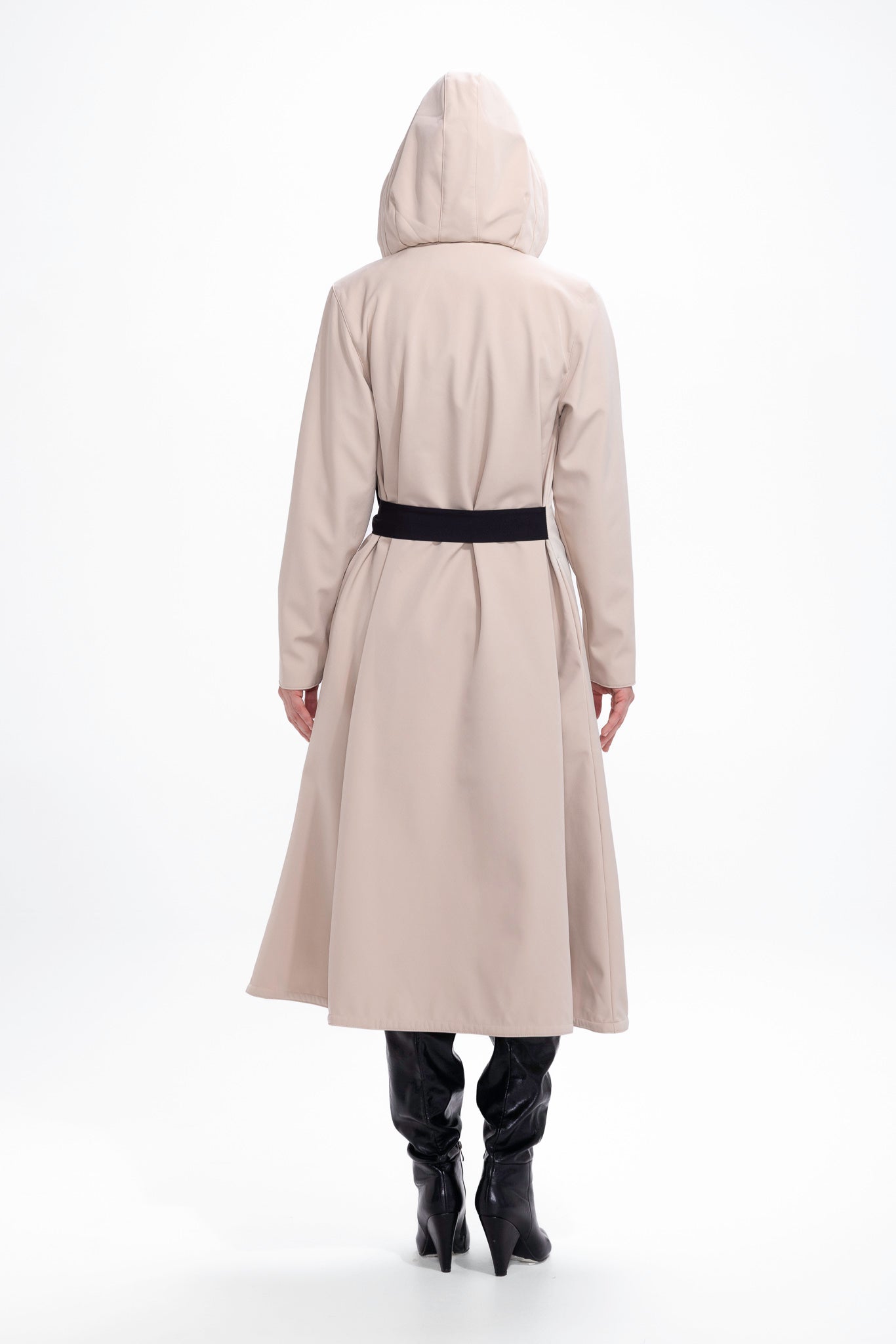 Back view of beige women's waterproof coat with flared trapeze cut silhouette