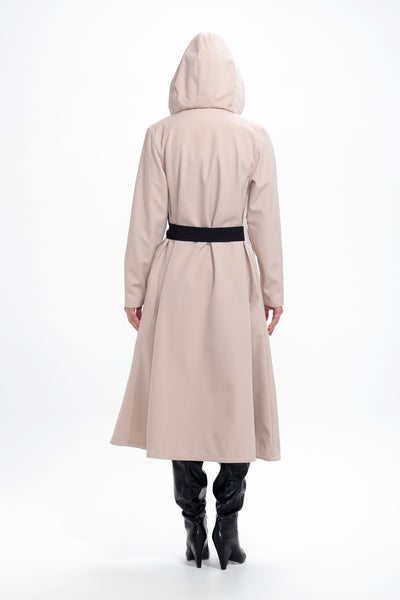 Back view of beige women's waterproof coat with flared trapeze cut silhouette