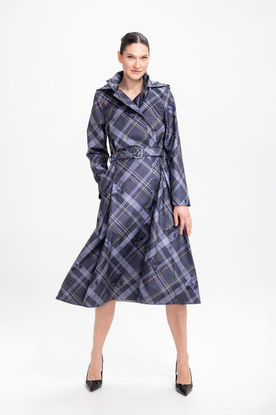 Model in motion wearing elegant blue plaid waterproof women's coat with pleated skirt detail