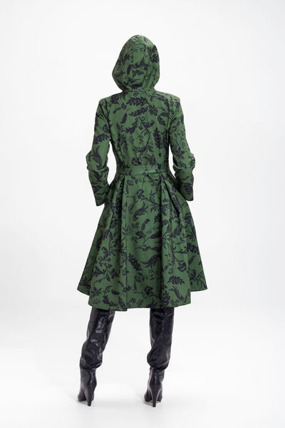 Back view of dark green floral women's coat with fitted waist and flared skirt design