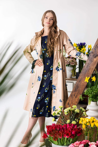 Elegant women’s long coat with flared skirt and silver-tone belt