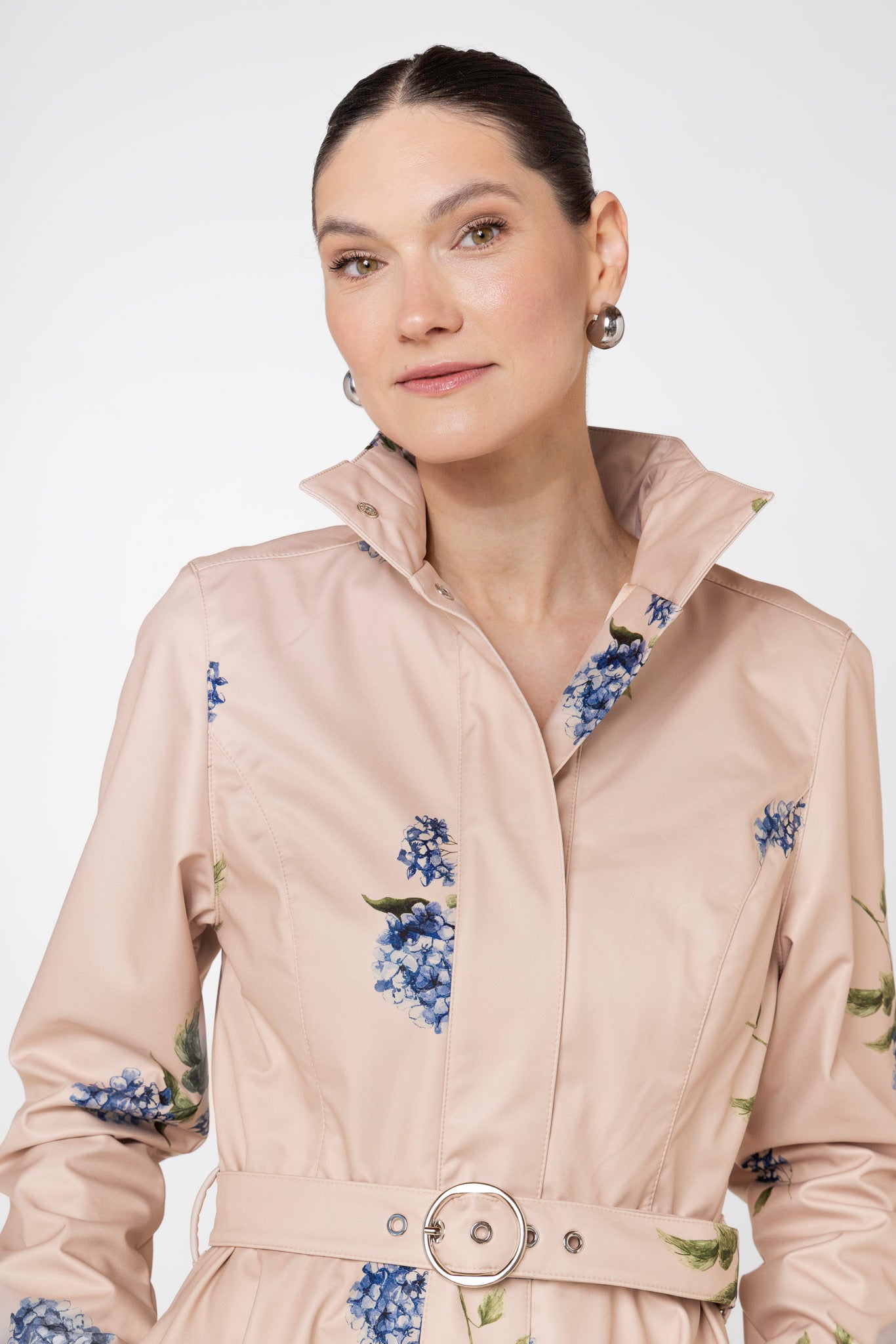 Detachable hood on beige waterproof women's coat by RainSisters