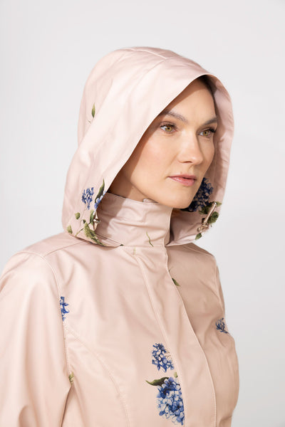 Close-up of hood detail on beige waterproof women's coat by RainSisters