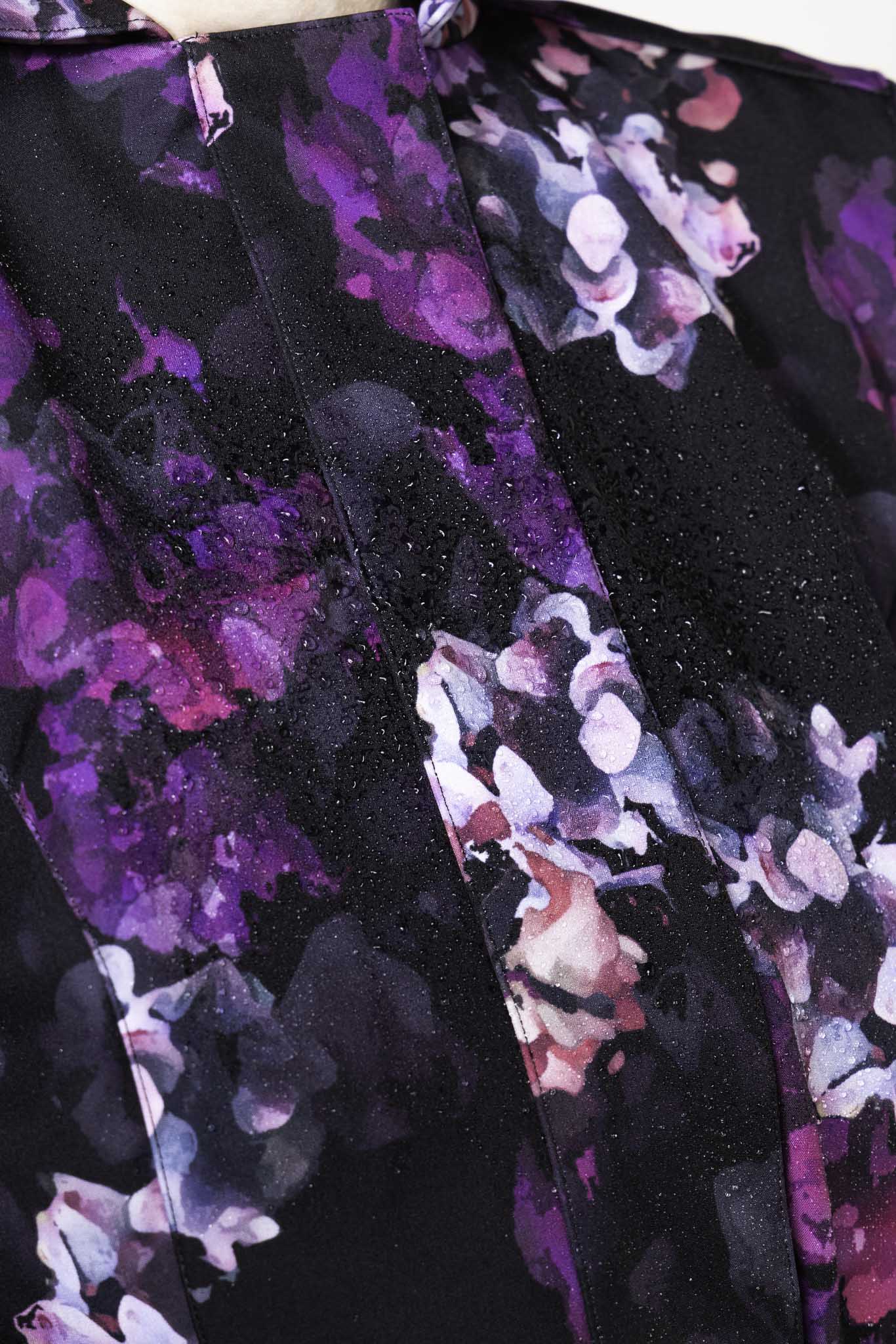 Purple and pink flower print detail on black women's designer trench coat by RainSisters